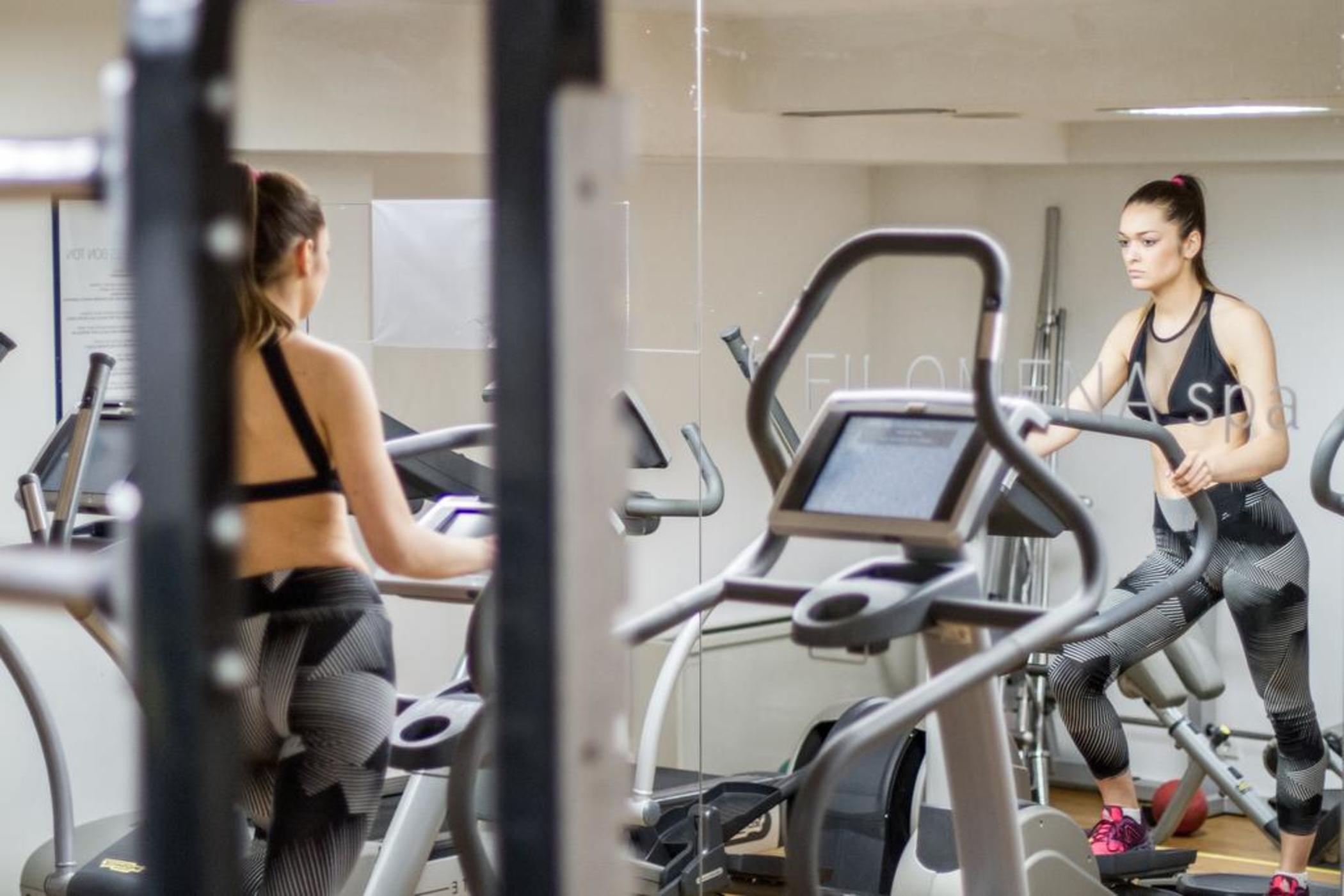 Hotel Atrium Split Exterior photo A woman on a cross trainer